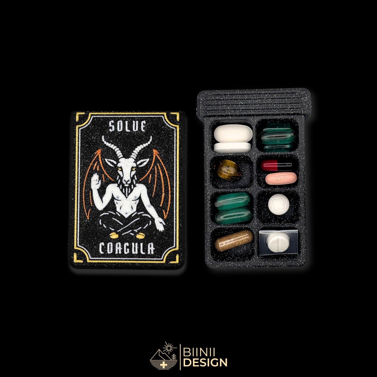 Baphomet cover beside 8-cpt weekly tray filled. Artistic pill organizer for spiritual supplement plans.