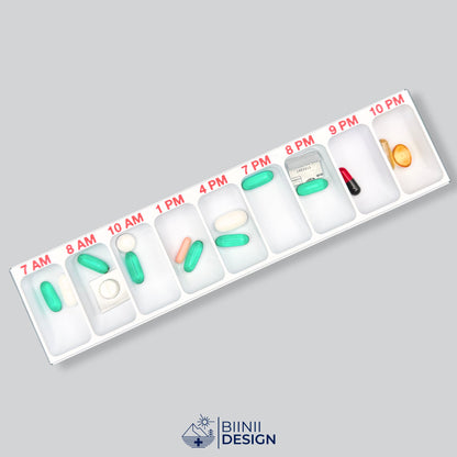 Open hourly pill organizer in US AM/PM format, compartments from 7 AM to 10 PM filled with tablets, capsules, softgels and cut blisters.