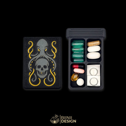 Kraken's Whisper art edition pill organizer lid beside its 4-compartment base filled with assorted supplements, kraken and skull artwork.