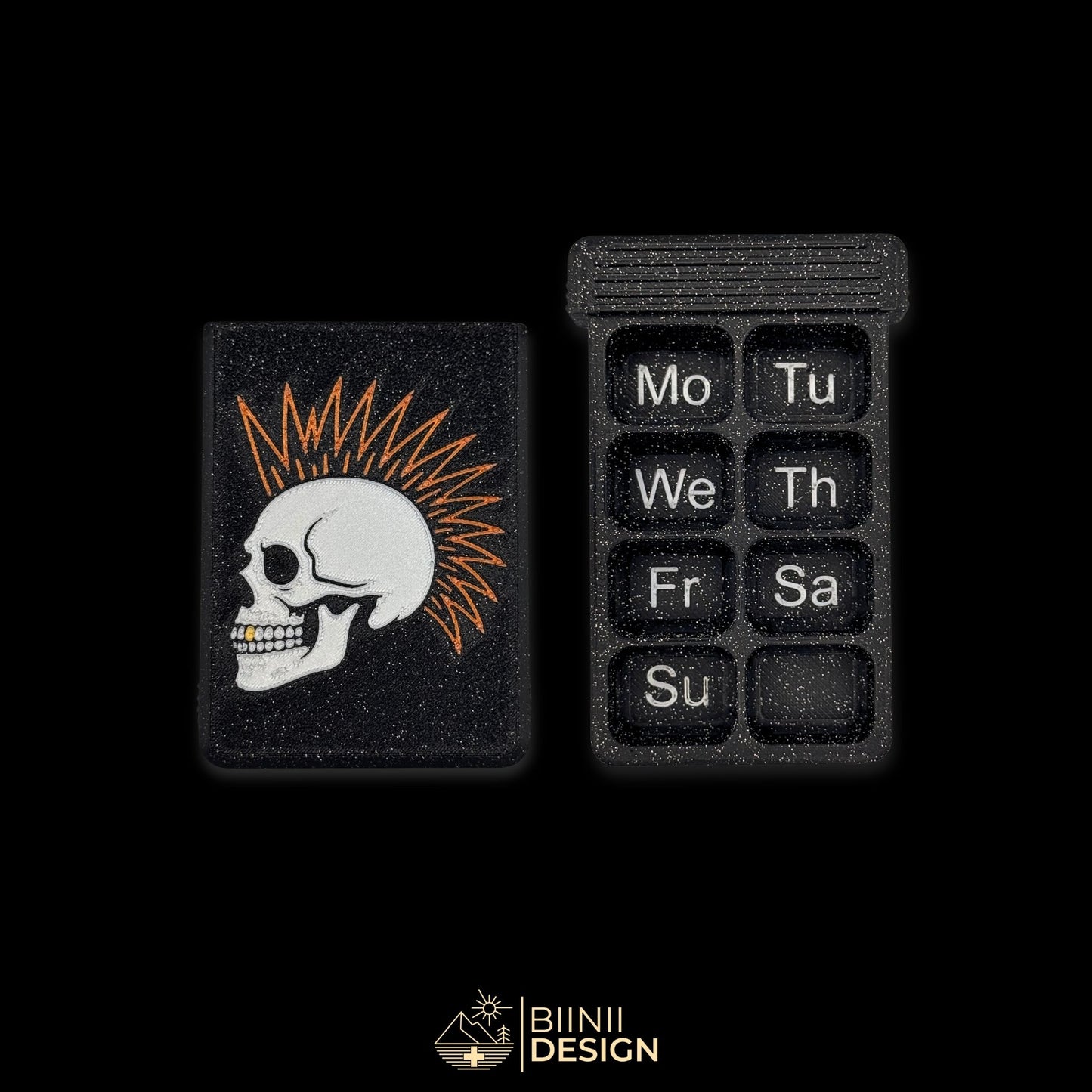 Punk Skull cover next to empty 8 compartment tray (EN Monday start). Weekly artistic pill organizer option for English speakers.
