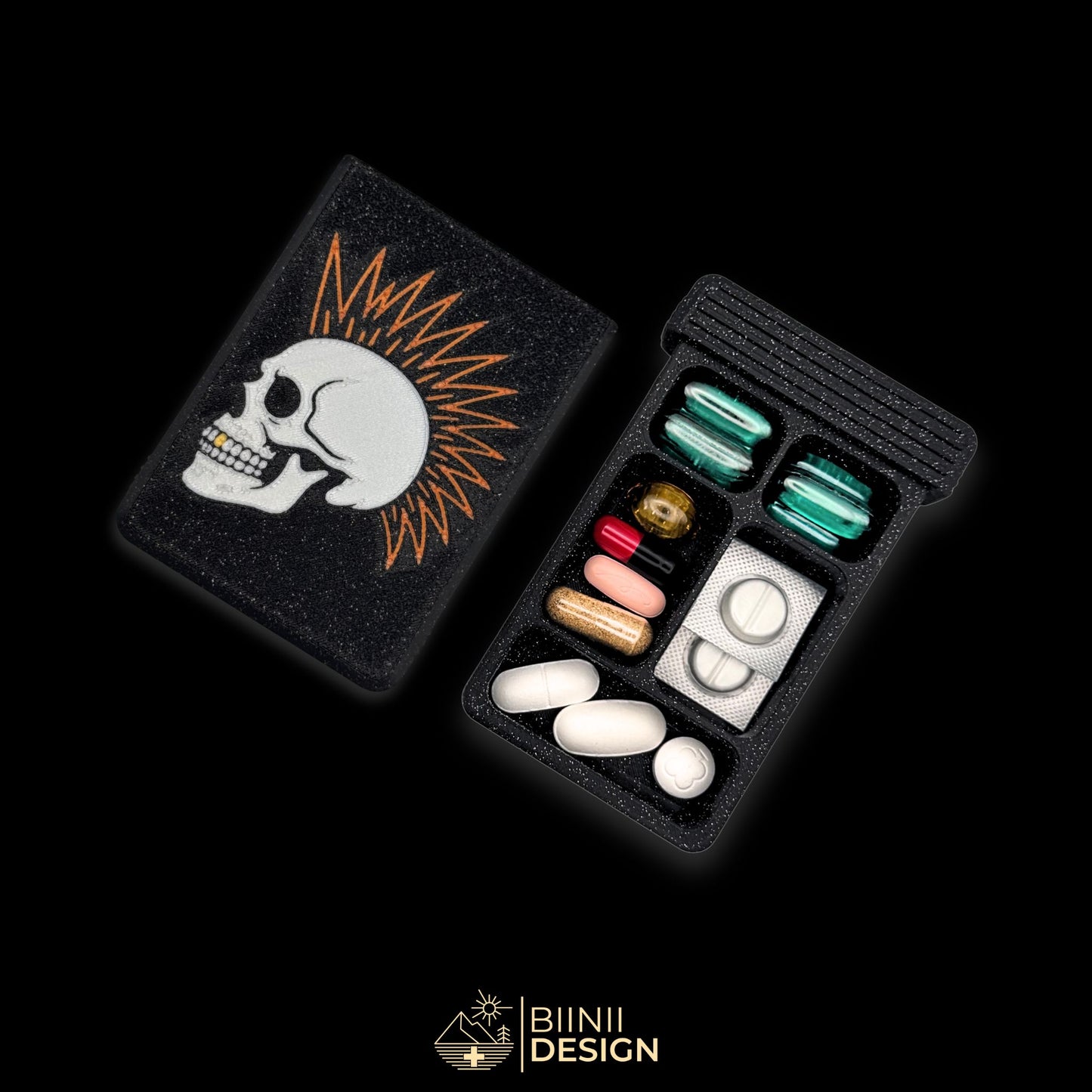 Punk Skull art pill organizer cover beside 5-compartment tray. Secure slide closure filled with supplements and medicines.