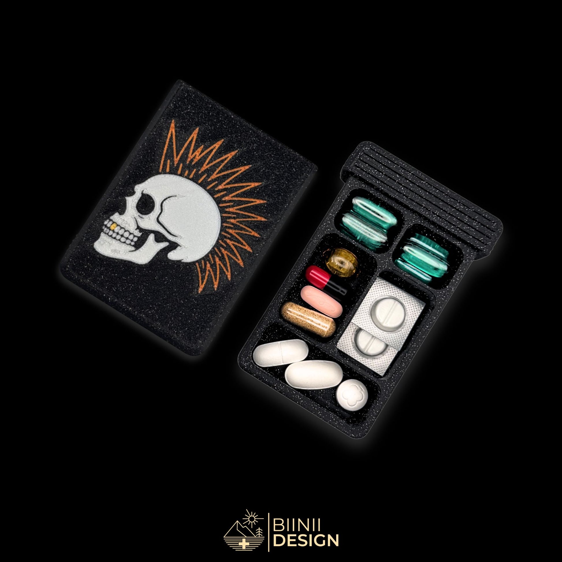 Punk Skull art pill organizer cover beside 5-compartment tray. Secure slide closure filled with supplements and medicines.