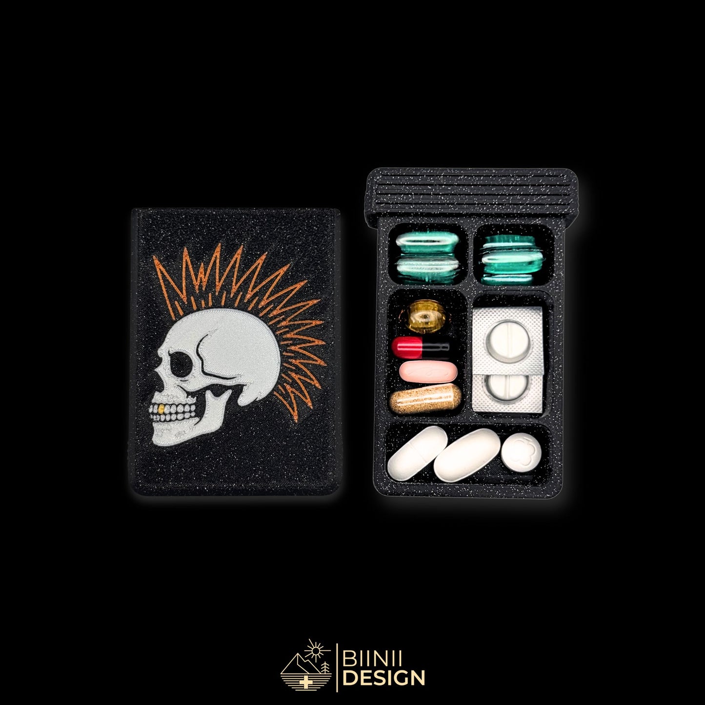 Punk Skull cover next to 5 compartment tray. Filled with capsules. Versatile compact daily pill case.