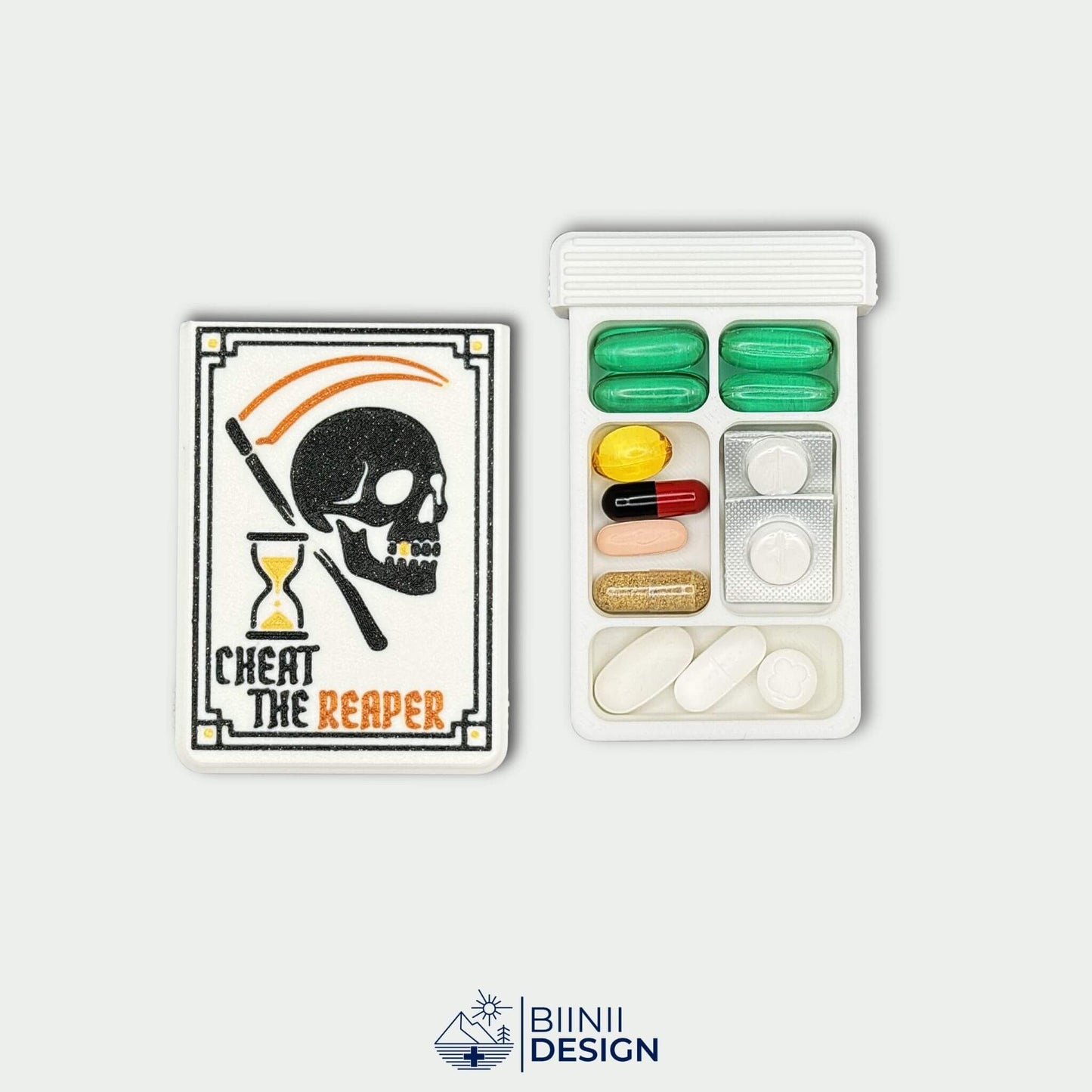 Cheat the Reaper White Edition lid beside 5 compartment tray filled with tablets and capsules. Compact travel pill case.
