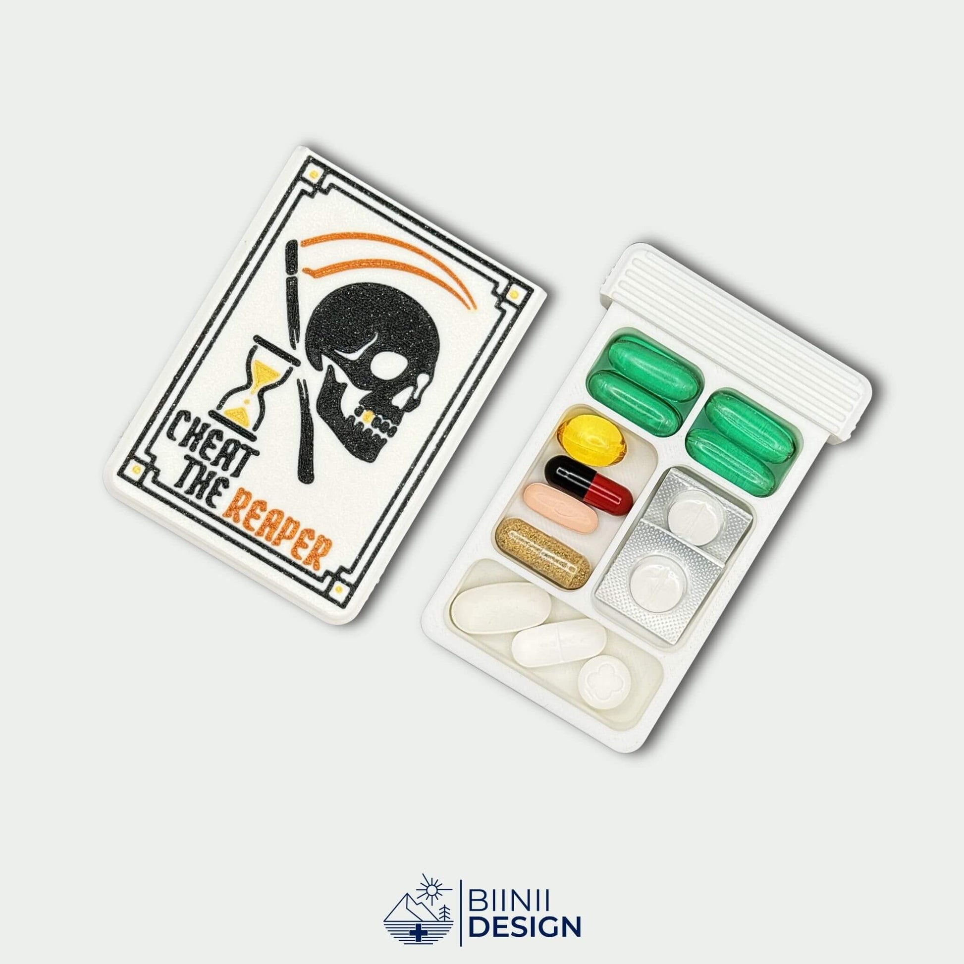 Cheat the Reaper White Edition lid beside 5 compartment tray filled with capsules. Compact daily pill organizer.