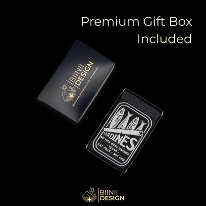 Sardines art edition pill organizer presented in its Biinii gift box, the sardine tin artwork on galaxy black.
