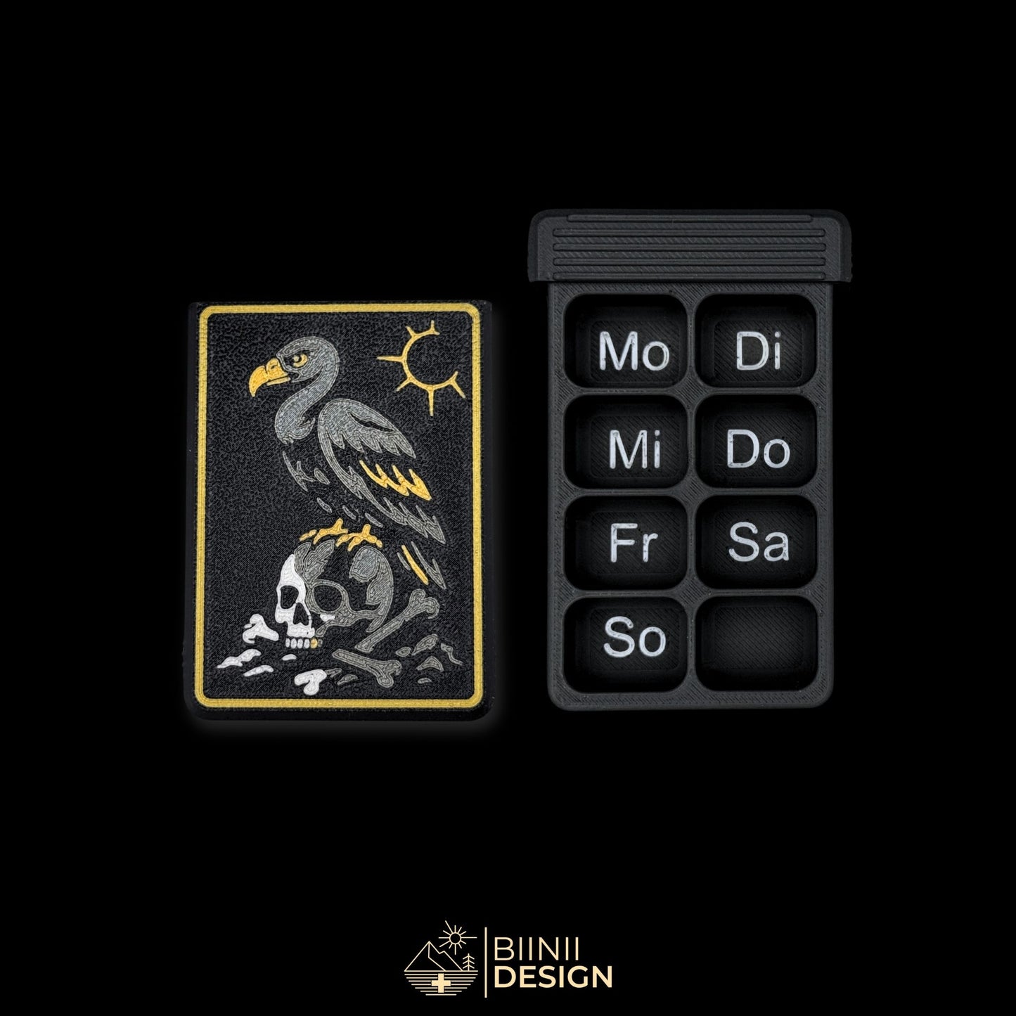 Vulture Shadow cover next to empty 8 compartment tray (DE days). Weekly artistic pill organizer option for German market.