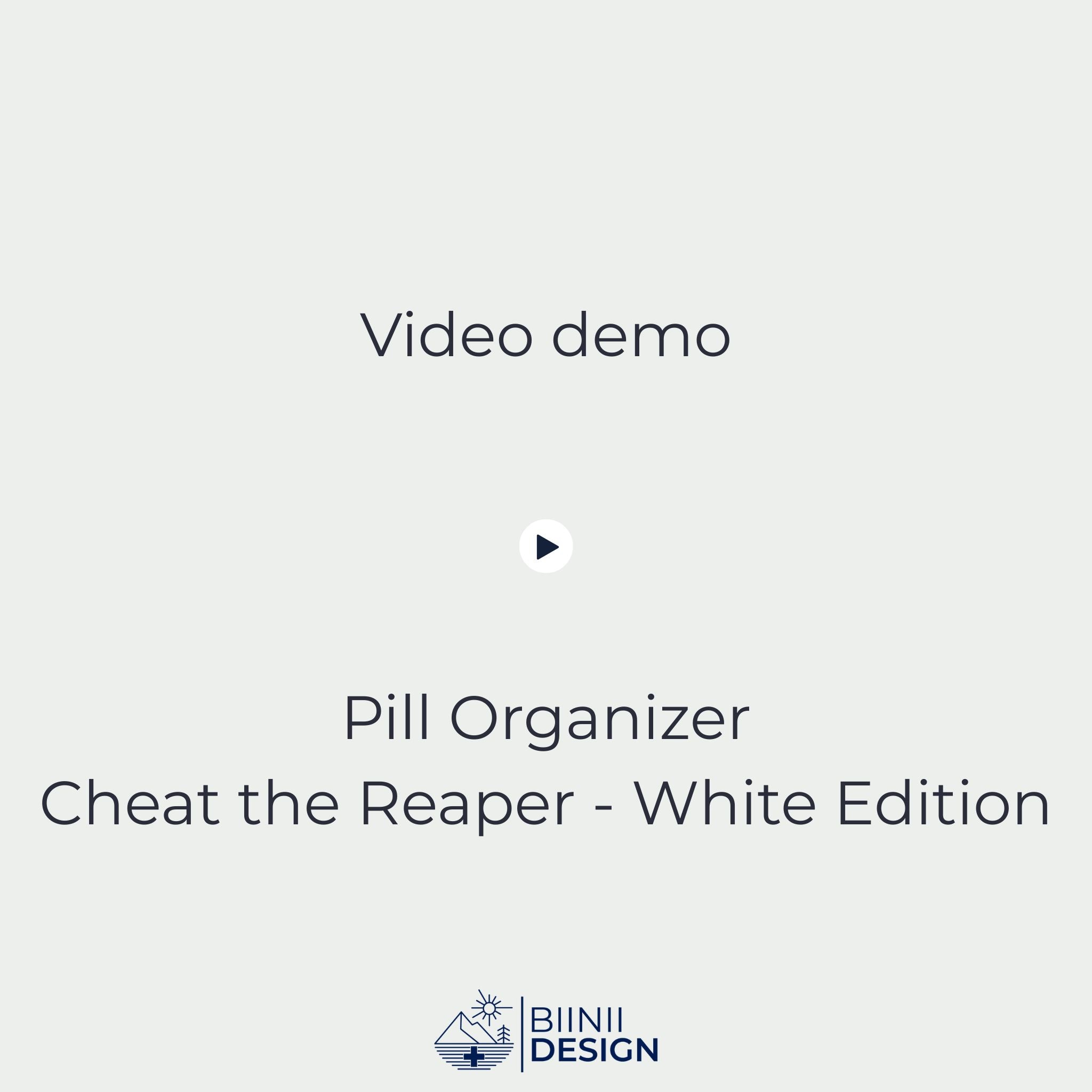 Video demonstration of the Cheat the Reaper White Edition sliding pill organizer opening and closing (5-compartment filled), then placed into its premium Swiss-made Biinii gift packaging.