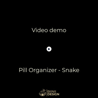 Demo video: the Snake sliding pill organizer opens with five compartments filled, closes, and sits in its Biinii gift box.