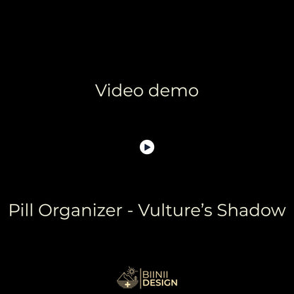 Demo video: the Vulture Shadow sliding pill organizer opens with five compartments filled, closes, and sits in its Biinii gift box.