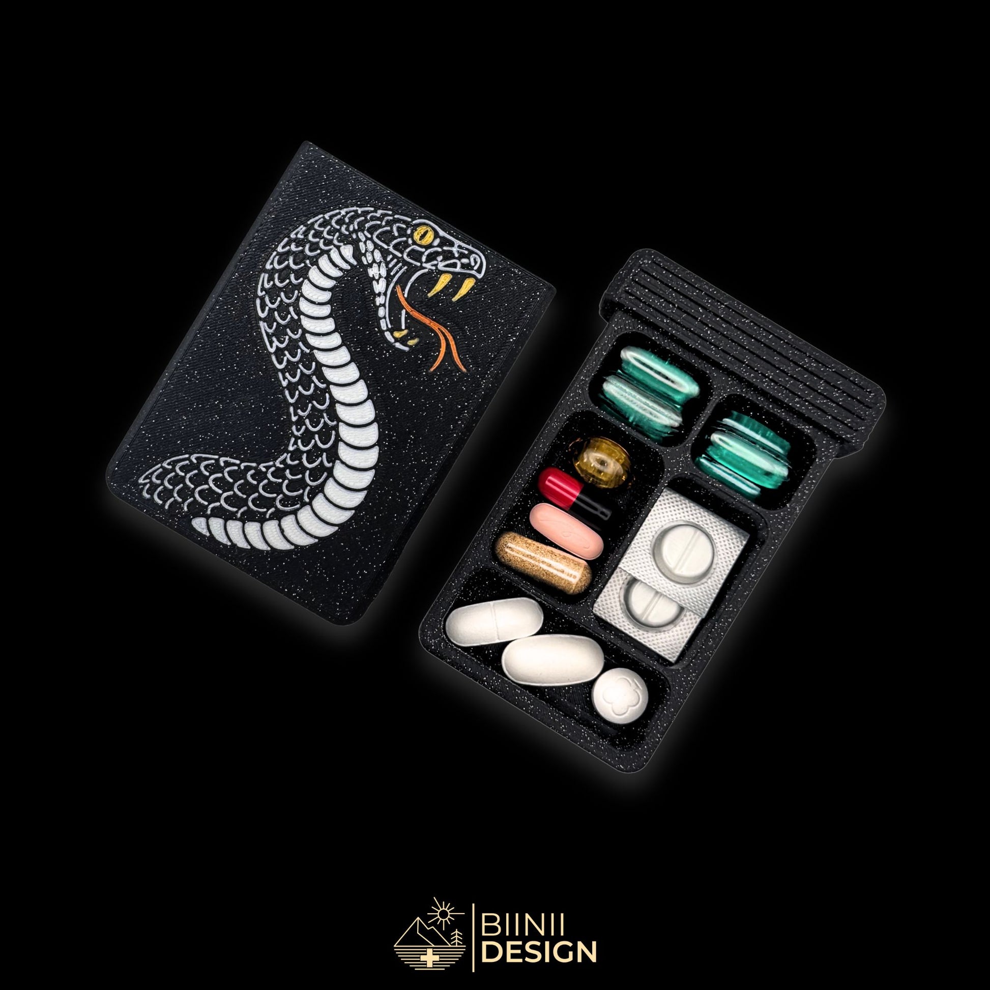Snake pillbox in galaxy black with drawer opened, Swiss-made artistic pill case for vitamins, supplements or meds.
Keywords: pillbox, pill case, artistic pill organizer, compact